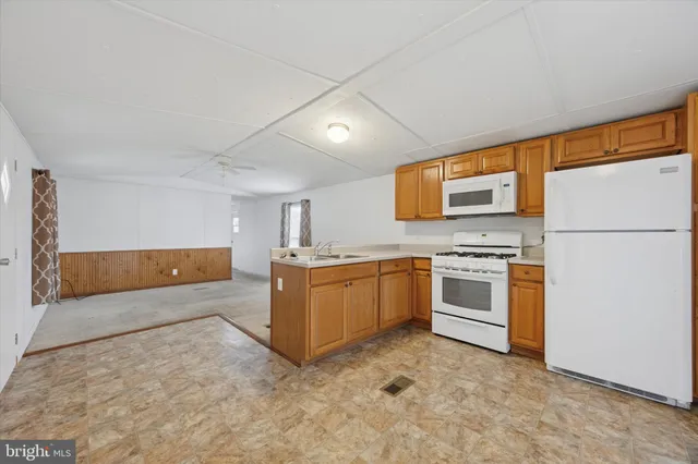 a kitchen with a refrigerator stove and microwave