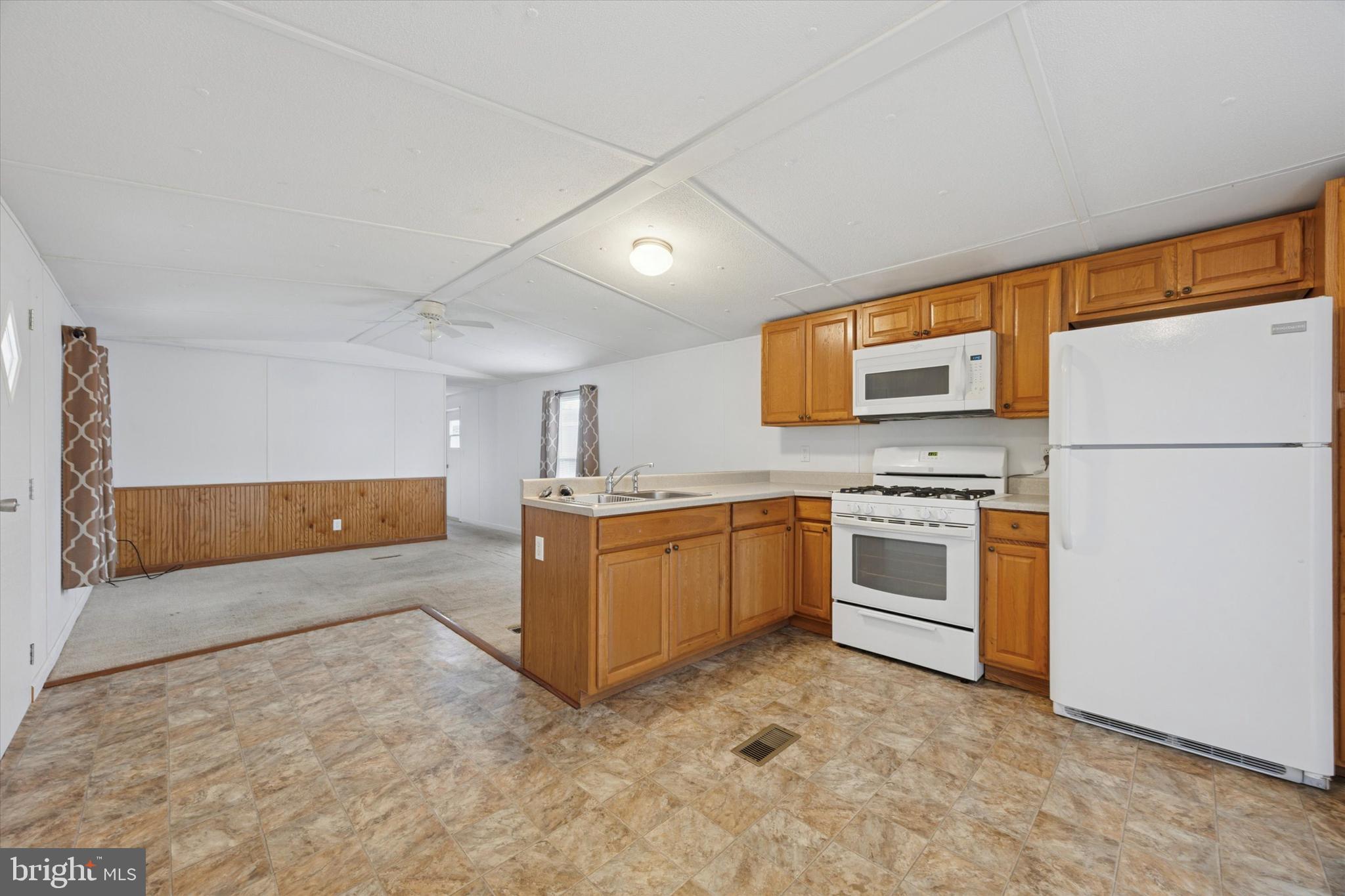20 Winterset Road Wilmington, DE 19810 - Photo 2 of 14 a kitchen with a refrigerator stove and microwave