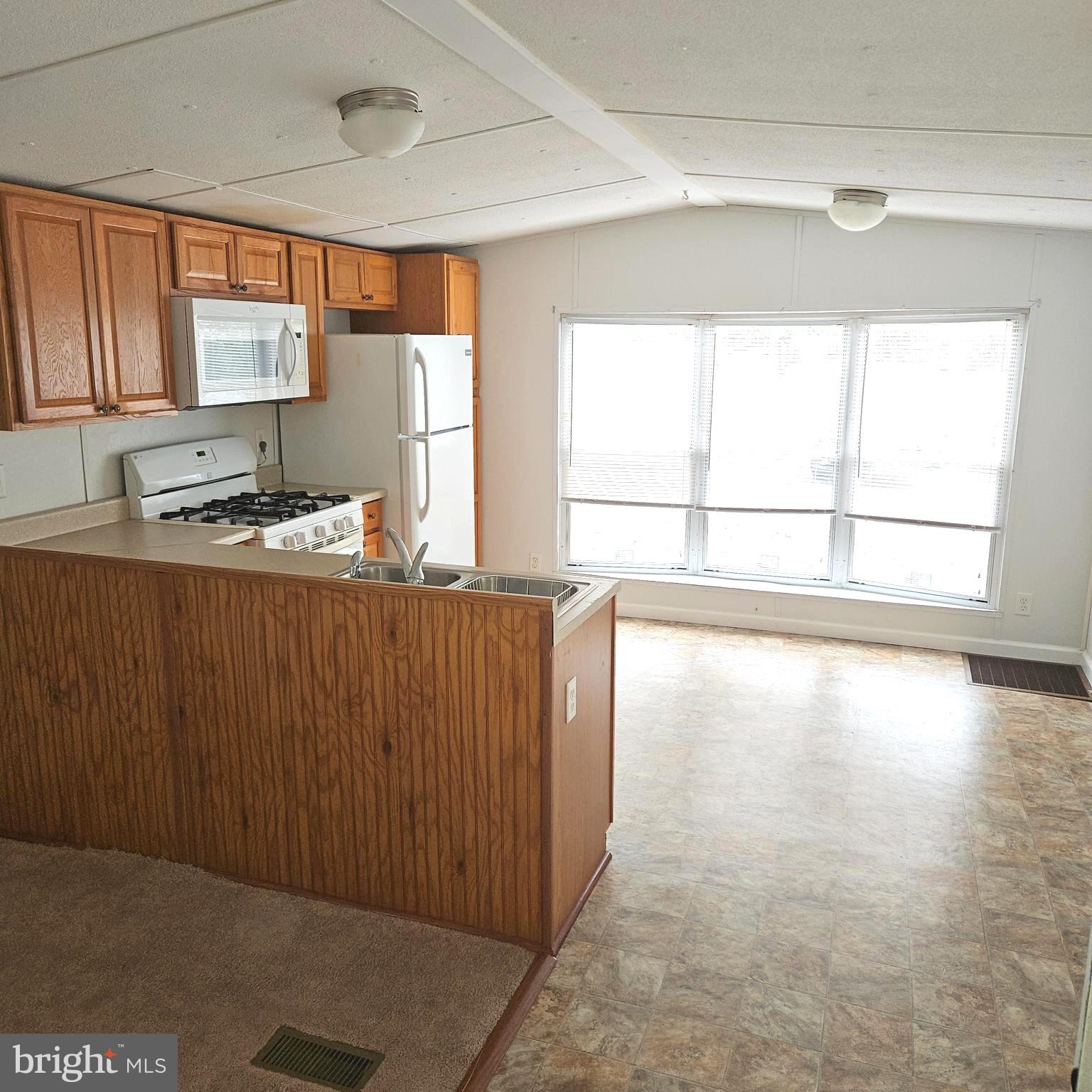 20 Winterset Road Wilmington, DE 19810 - Photo 4 of 14 a room with a window and a kitchen view