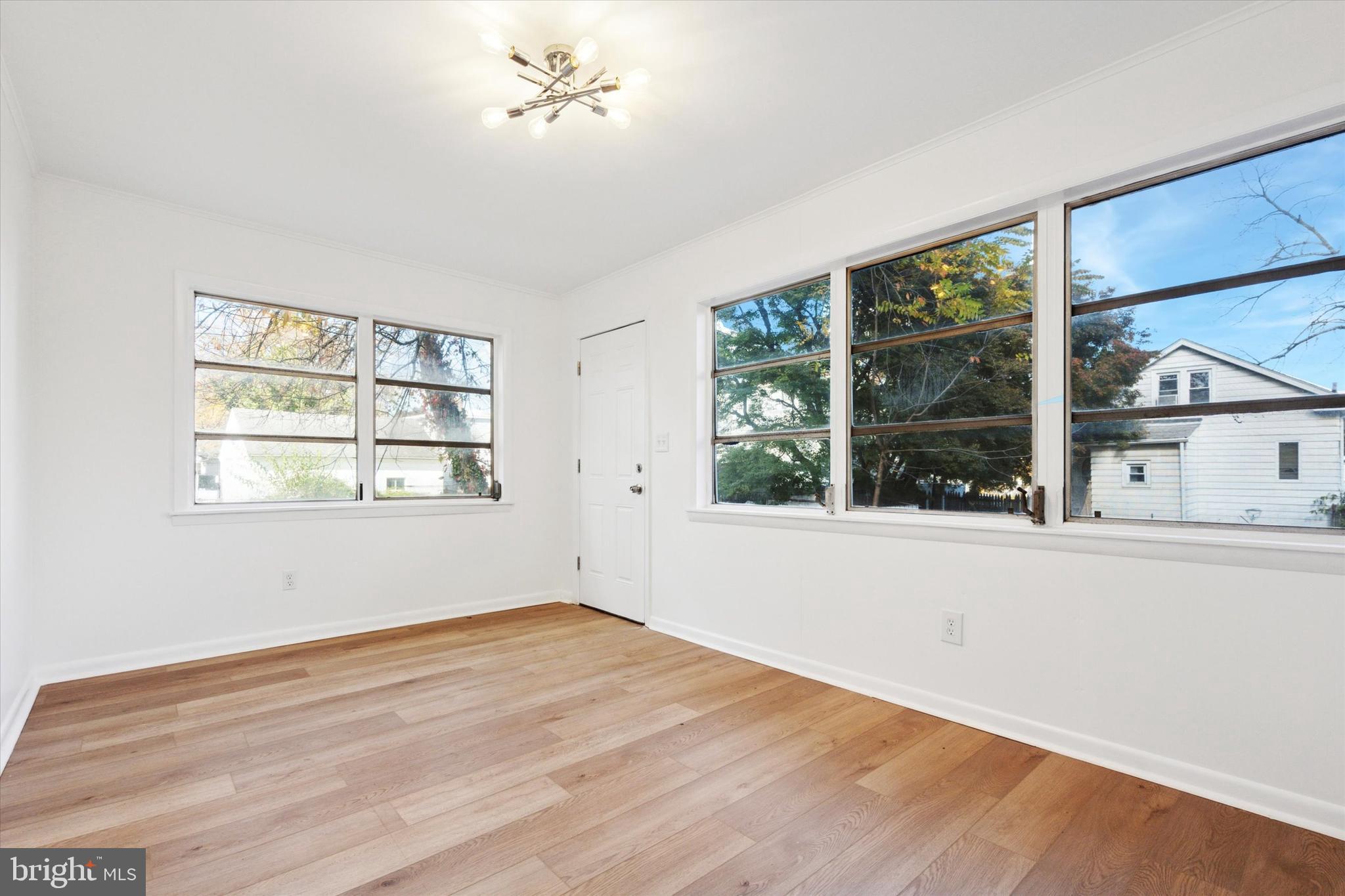 260 Weber Avenue Ewing, NJ 08638 - Photo 12 of 25 a view of empty room with wooden floor and fan
