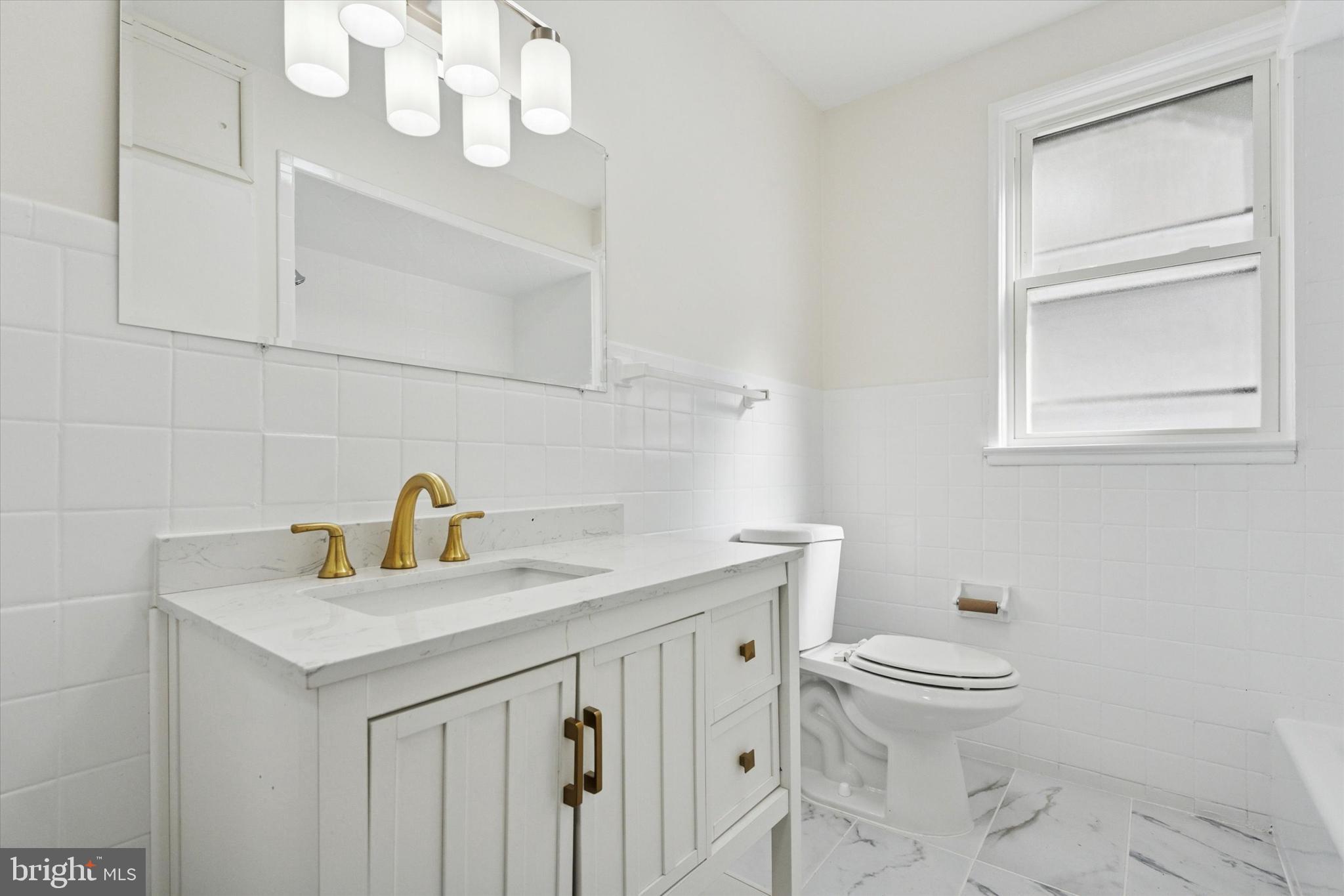 260 Weber Avenue Ewing, NJ 08638 - Photo 15 of 25 a bathroom with a sink a toilet and a mirror