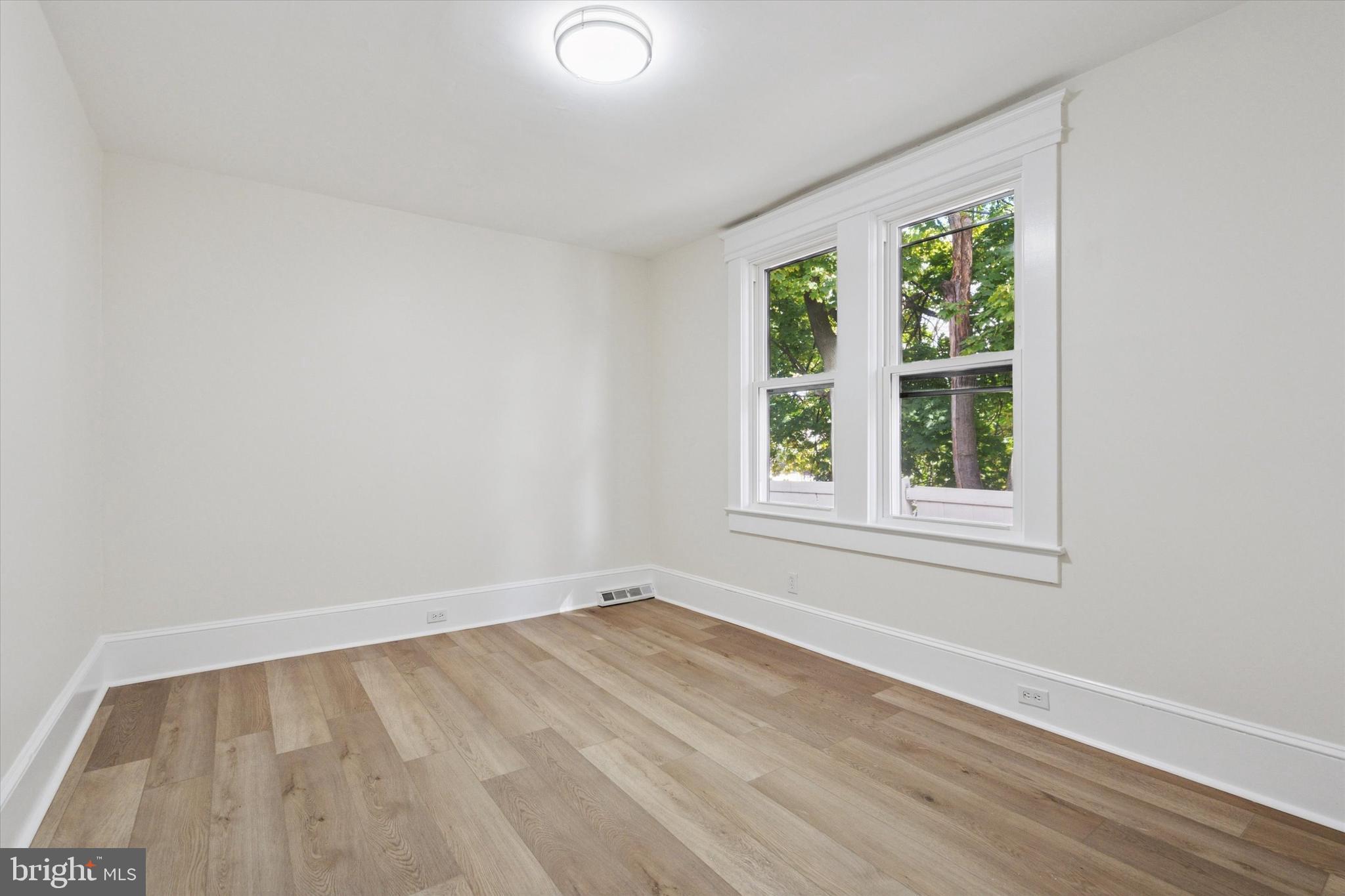 260 Weber Avenue Ewing, NJ 08638 - Photo 17 of 25 an empty room with wooden floor and windows
