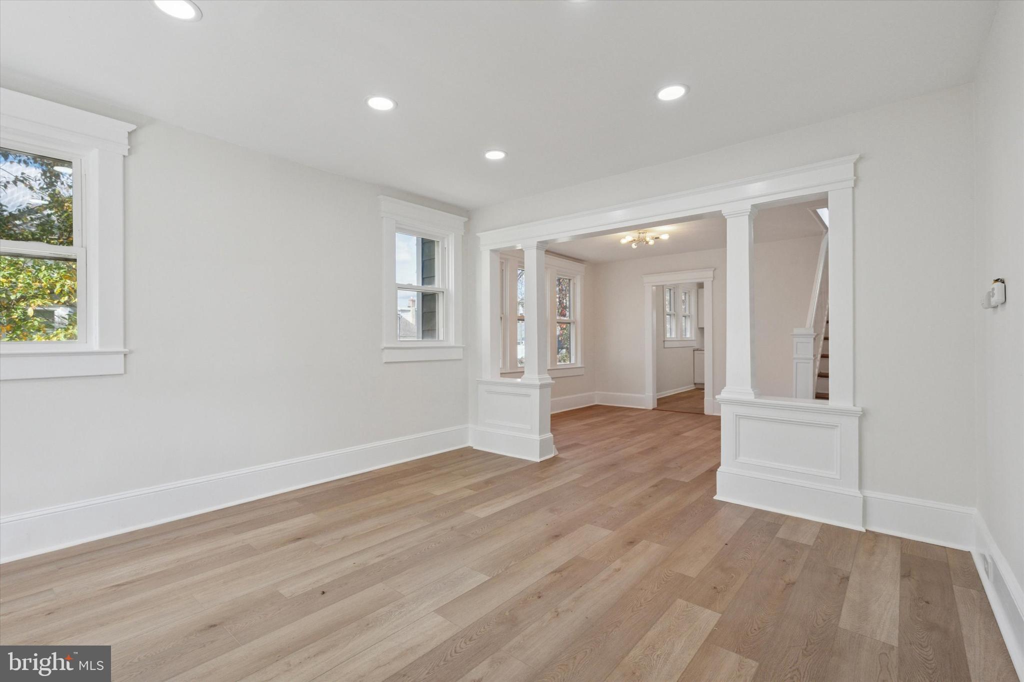 260 Weber Avenue Ewing, NJ 08638 - Photo 3 of 25 a view of an empty room with wooden floor and a window