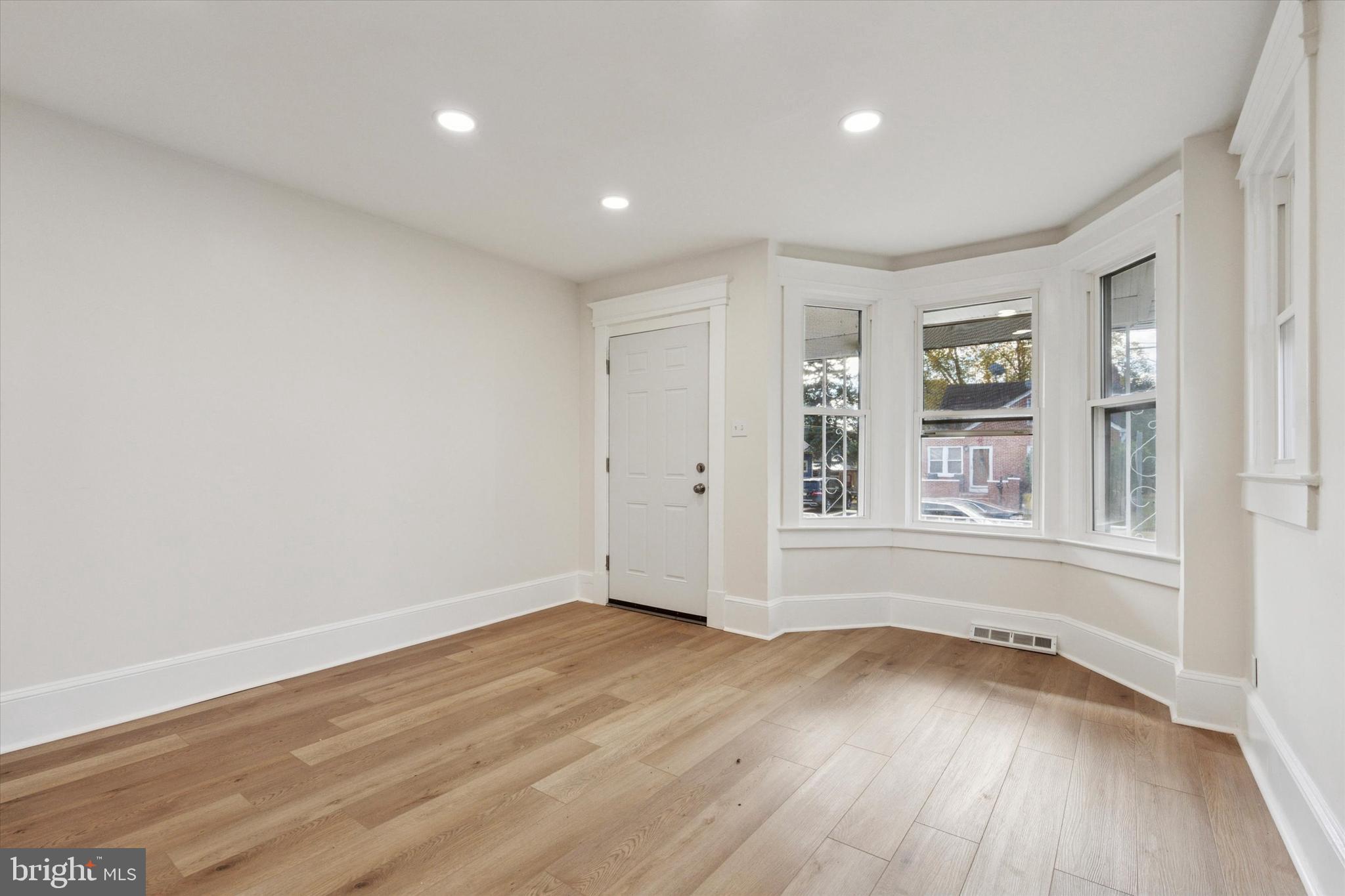 260 Weber Avenue Ewing, NJ 08638 - Photo 5 of 25 a view of an empty room with wooden floor and a window