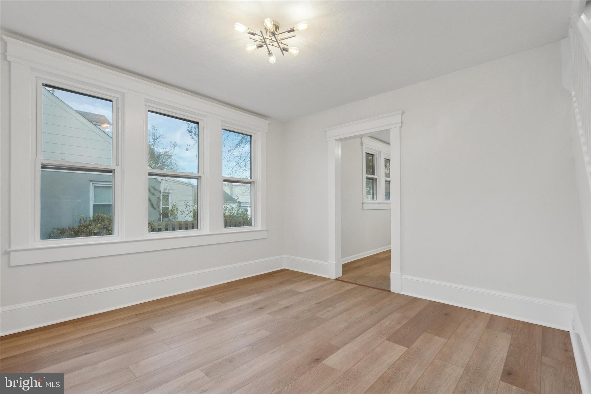 260 Weber Avenue Ewing, NJ 08638 - Photo 7 of 25 a view of an empty room with wooden floor and a window