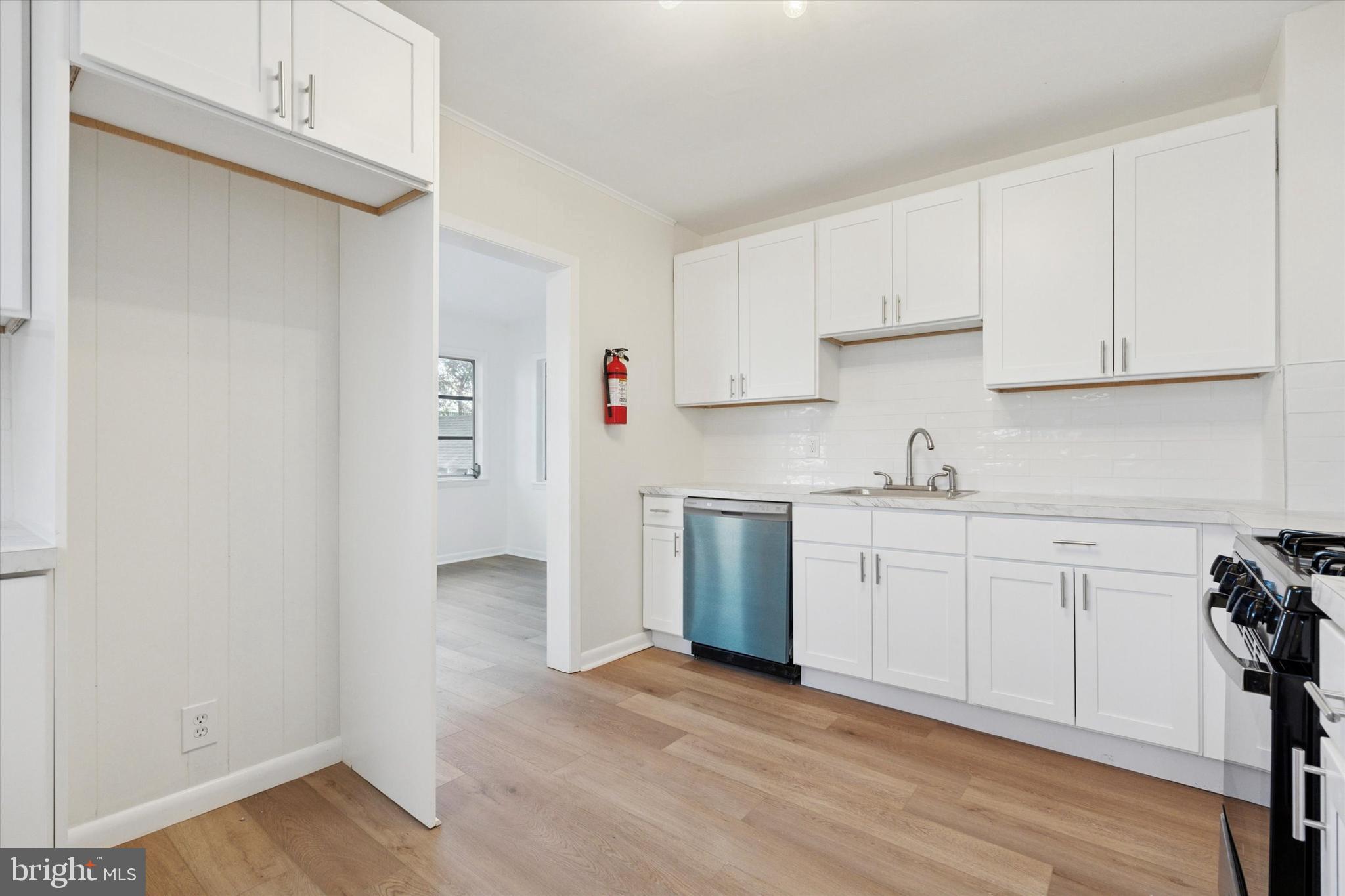 260 Weber Avenue Ewing, NJ 08638 - Photo 9 of 25 a kitchen with granite countertop white cabinets and white appliances