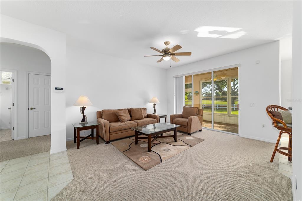 8404 Southwest 82nd Circle Ocala, FL 34481 - Photo 13 of 58 a living room with furniture and a large window