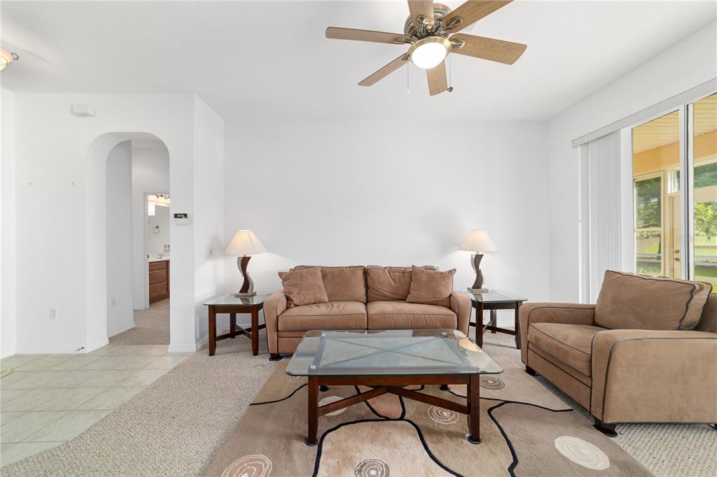 8404 Southwest 82nd Circle Ocala, FL 34481 - Photo 14 of 58 a living room with furniture and a large window