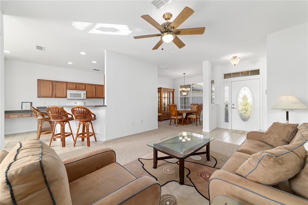 8404 Southwest 82nd Circle Ocala, FL 34481 - Photo 17 of 58 a living room with furniture and kitchen view