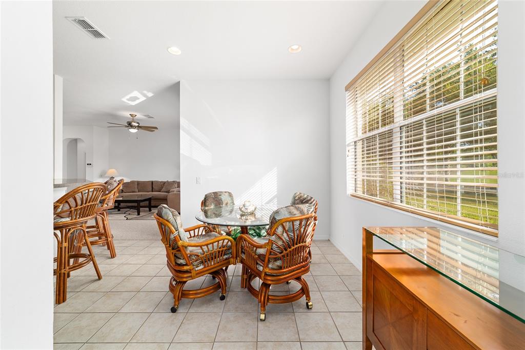 8404 Southwest 82nd Circle Ocala, FL 34481 - Photo 29 of 58 a dining room with furniture and window