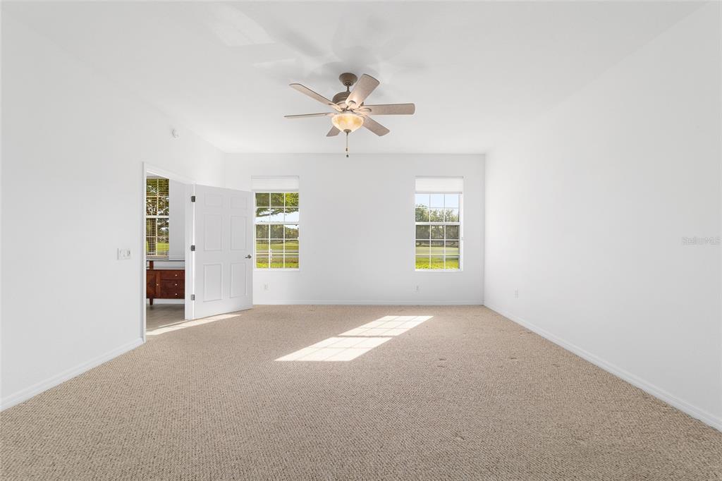 8404 Southwest 82nd Circle Ocala, FL 34481 - Photo 33 of 58 a view of a room with a ceiling fan and window
