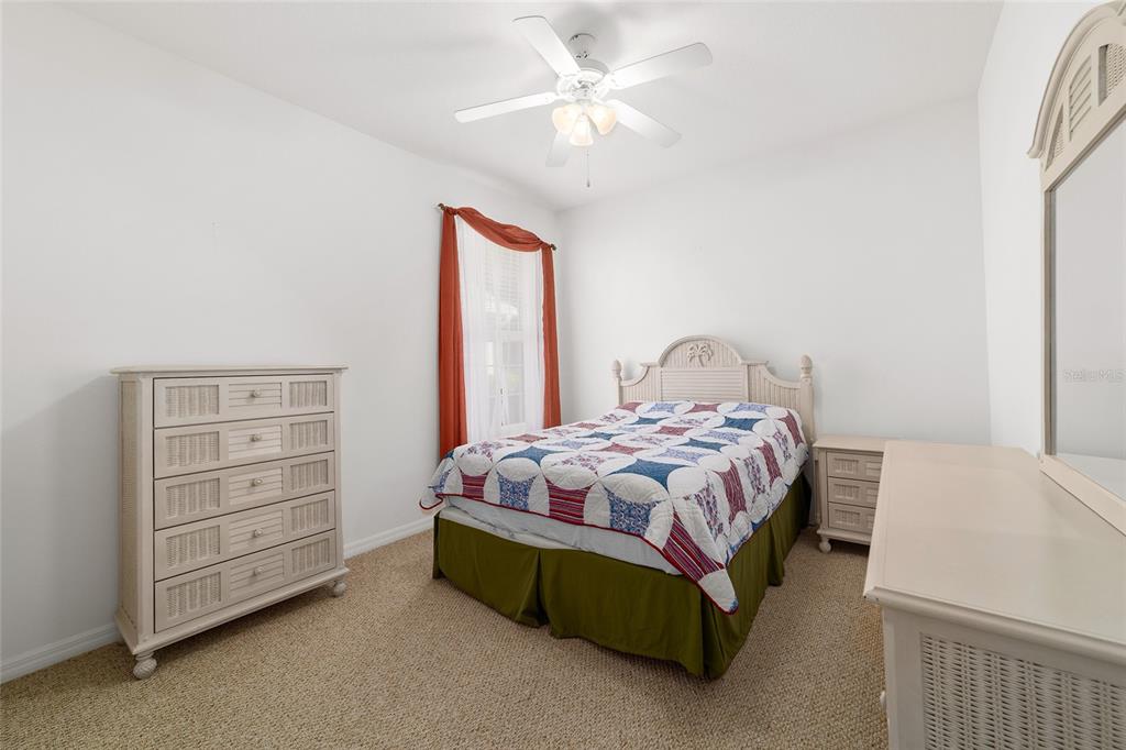 8404 Southwest 82nd Circle Ocala, FL 34481 - Photo 47 of 58 a bedroom with a bed and a dresser