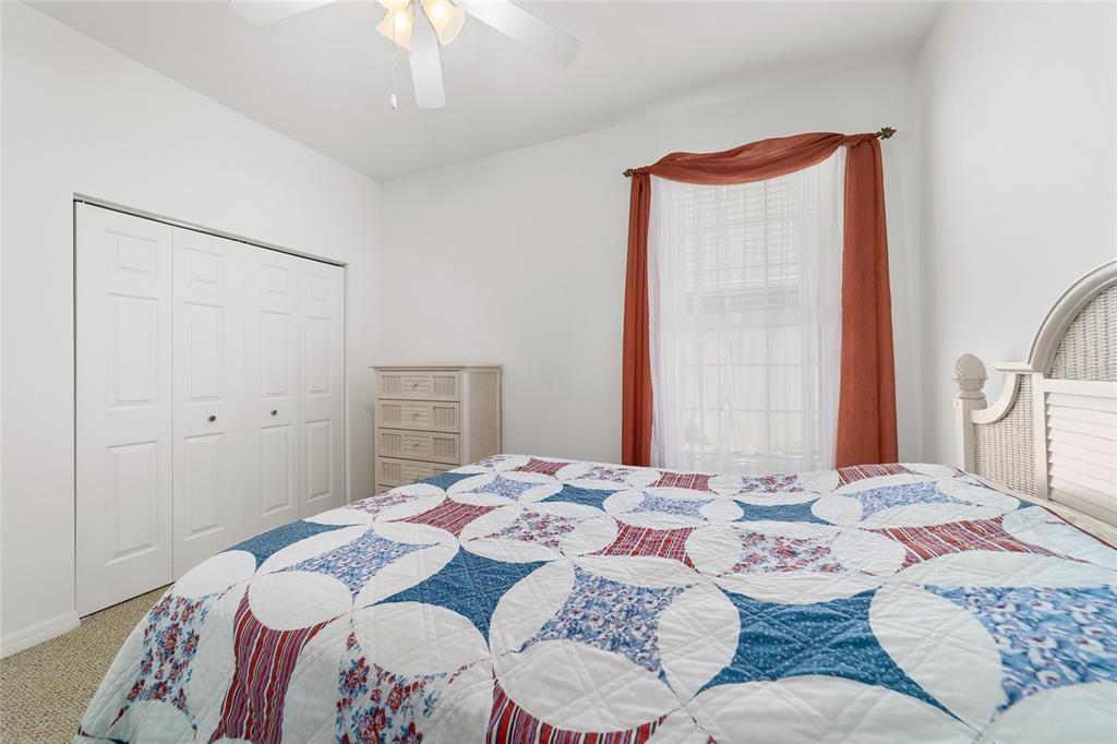 8404 Southwest 82nd Circle Ocala, FL 34481 - Photo 48 of 58 a bedroom with a bed and a mirror