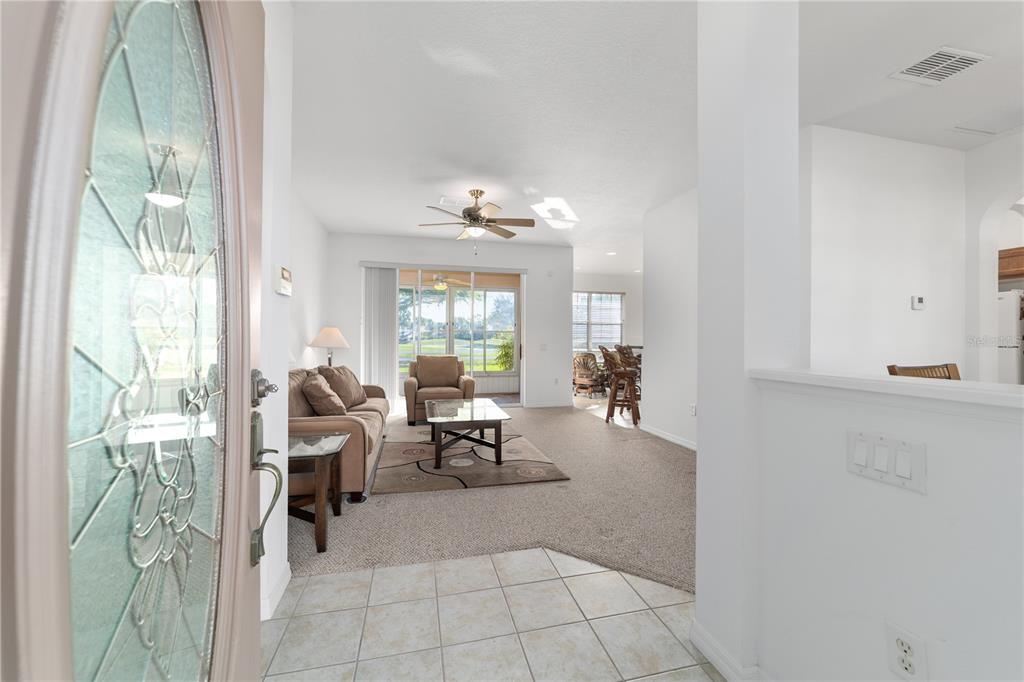 8404 Southwest 82nd Circle Ocala, FL 34481 - Photo 10 of 58 a living room with furniture and a large window
