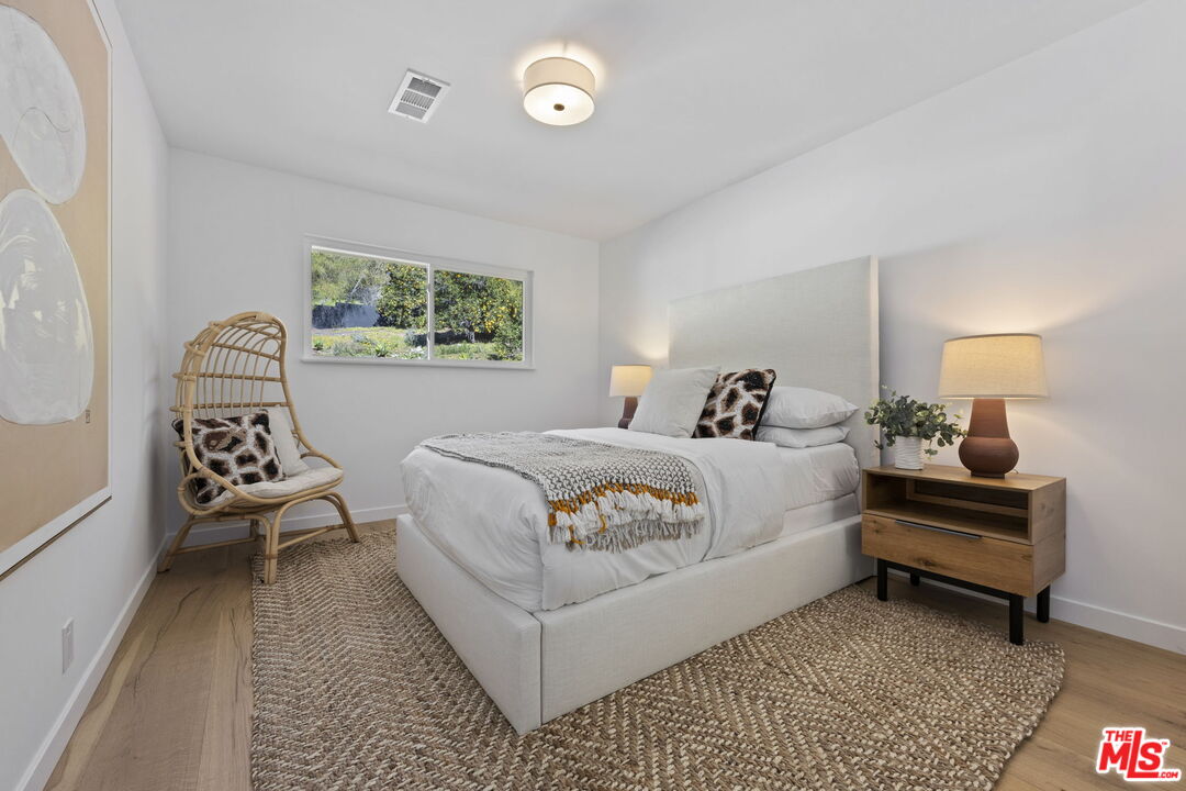 431 Montana Circle Ojai, CA 93023 - Photo 27 of 73 a bedroom with a bed and a chair