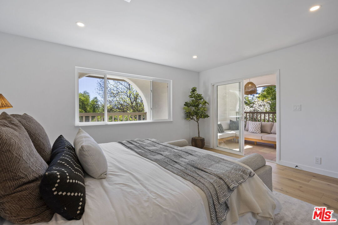 431 Montana Circle Ojai, CA 93023 - Photo 31 of 73 a bedroom with a bed and a large window