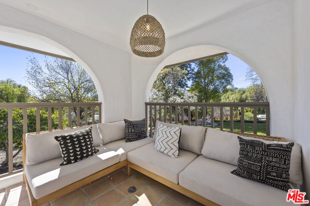 431 Montana Circle Ojai, CA 93023 - Photo 33 of 73 a living room with furniture and a floor to ceiling window