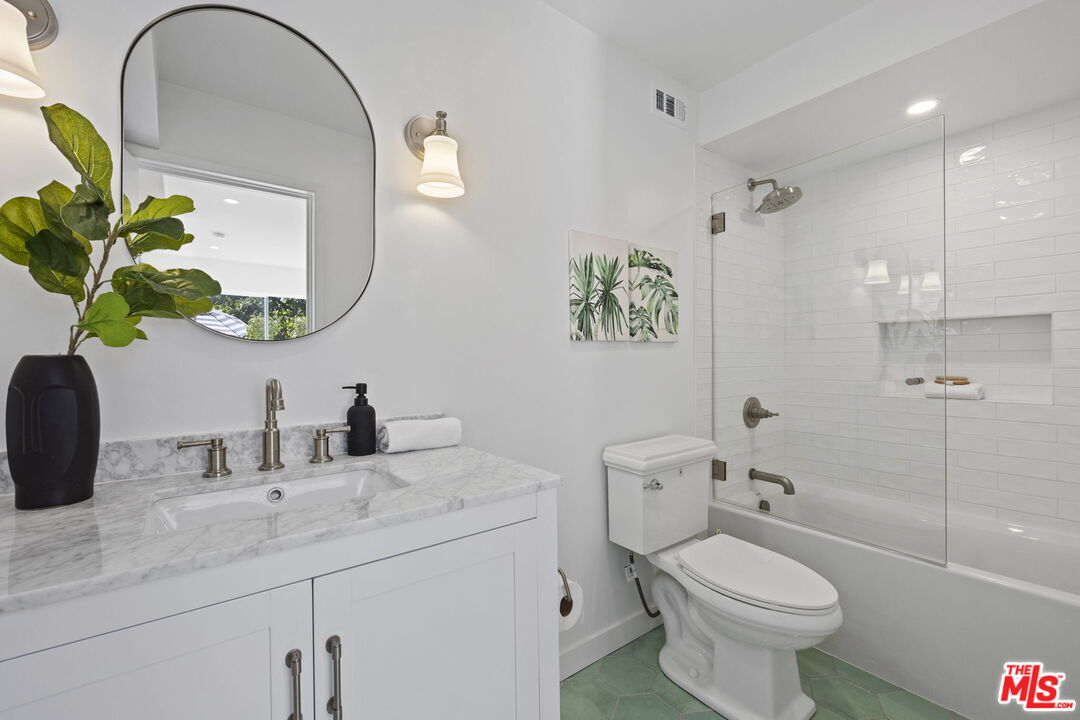 431 Montana Circle Ojai, CA 93023 - Photo 41 of 73 a bathroom with a granite countertop toilet sink and mirror