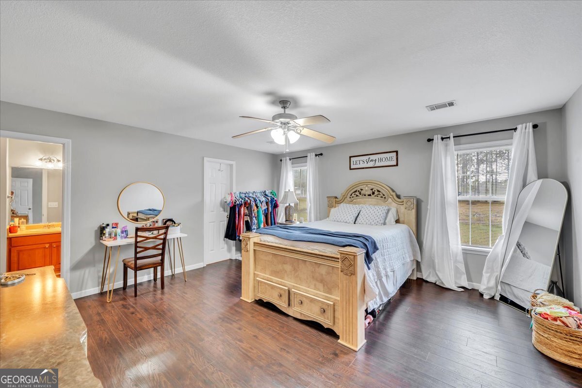 1004 Robertson Church Road Dublin, GA 31021 - Photo 5 of 12 a bed room with bed and window