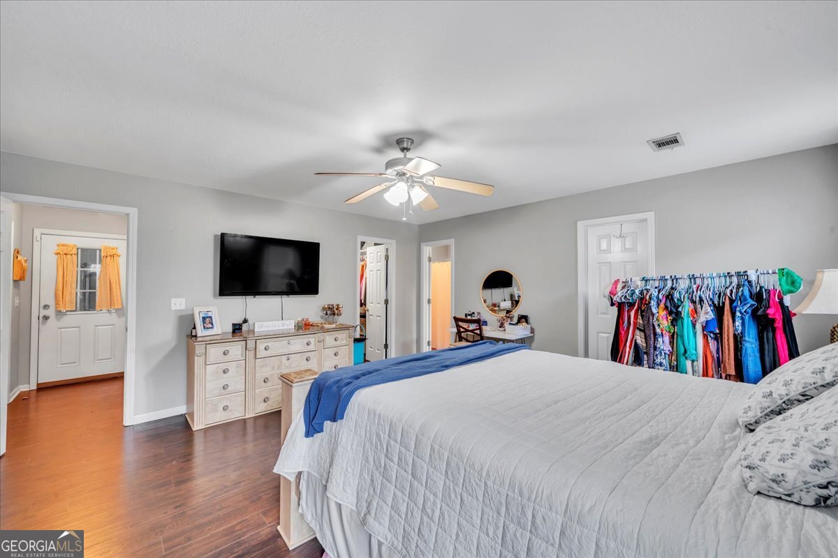 1004 Robertson Church Road Dublin, GA 31021 - Photo 6 of 12 a bedroom with a bed and a flat screen tv