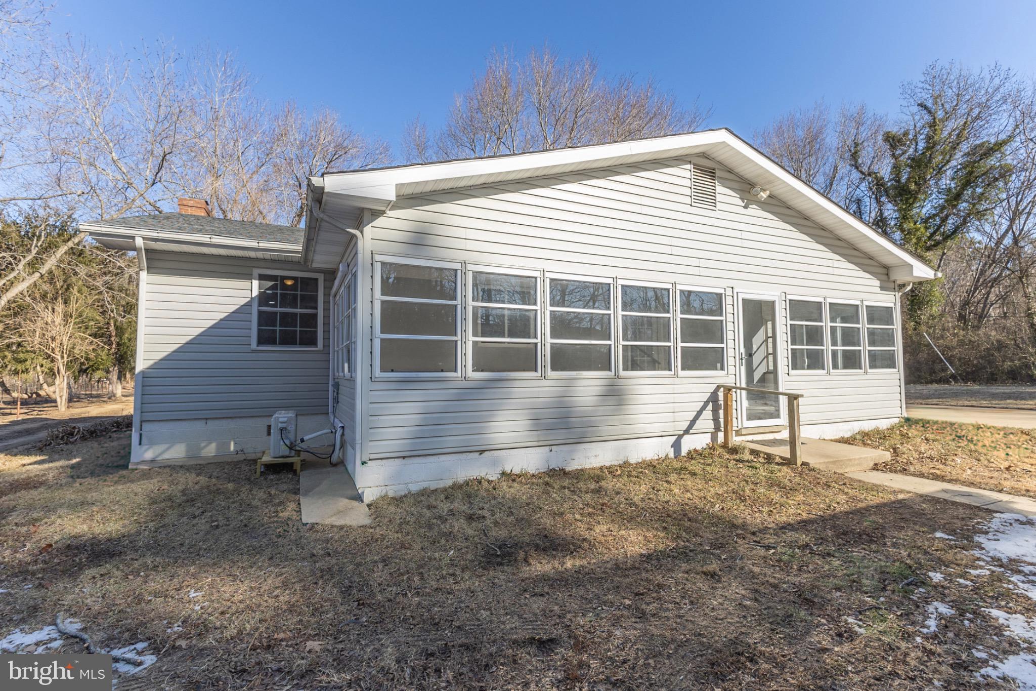 49151 Wynne Road Ridge, MD 20680 - Photo 63 of 80 Charming home with expansive windows and nature.