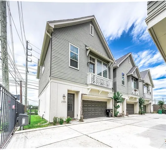 a front view of a house with garage