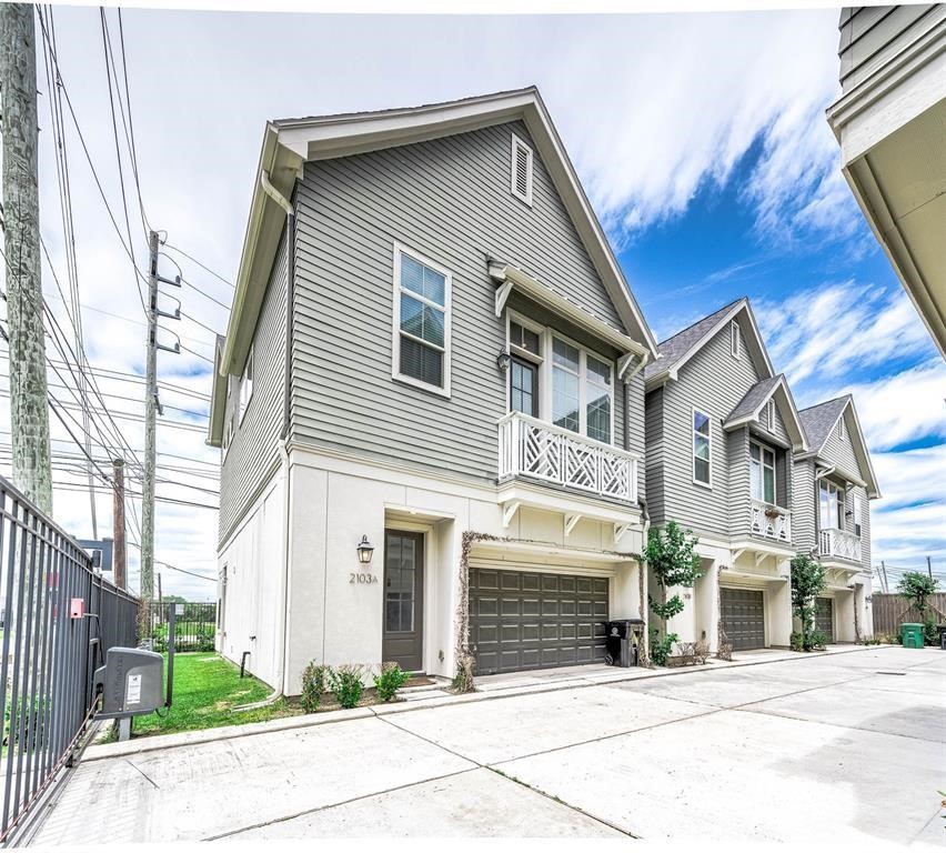 a front view of a house with garage