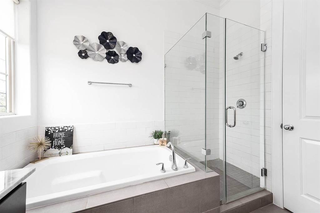 2103 Naomi Street, Unit A Houston, TX 77054 - Photo 13 of 19 a bathroom with a tub and shower
