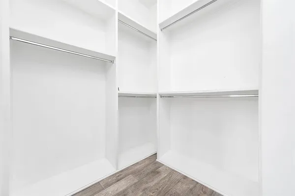 a view of an empty walk in closet