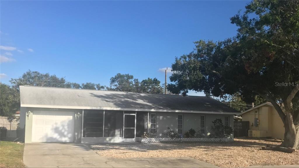 4531 South Beneva Road Sarasota, FL 34233 - Photo 1 of 1 front view of a house with a yard