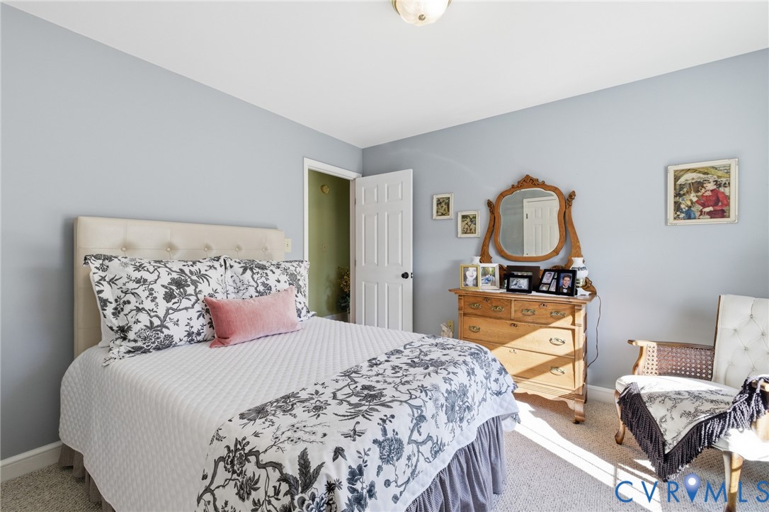 6606 West Quaker Road Disputanta, VA 23842 - Photo 21 of 32 Bedroom with carpet and baseboards