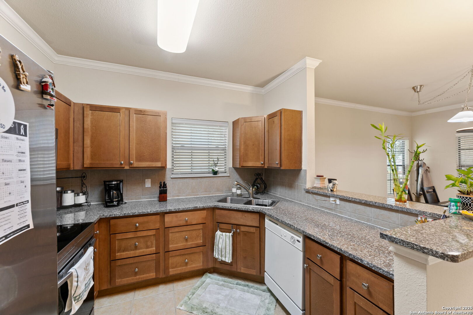 6160 Eckhert Road, Unit 204 San Antonio, TX 78240 - Photo 12 of 30 a kitchen with stainless steel appliances granite countertop a sink stove and cabinets