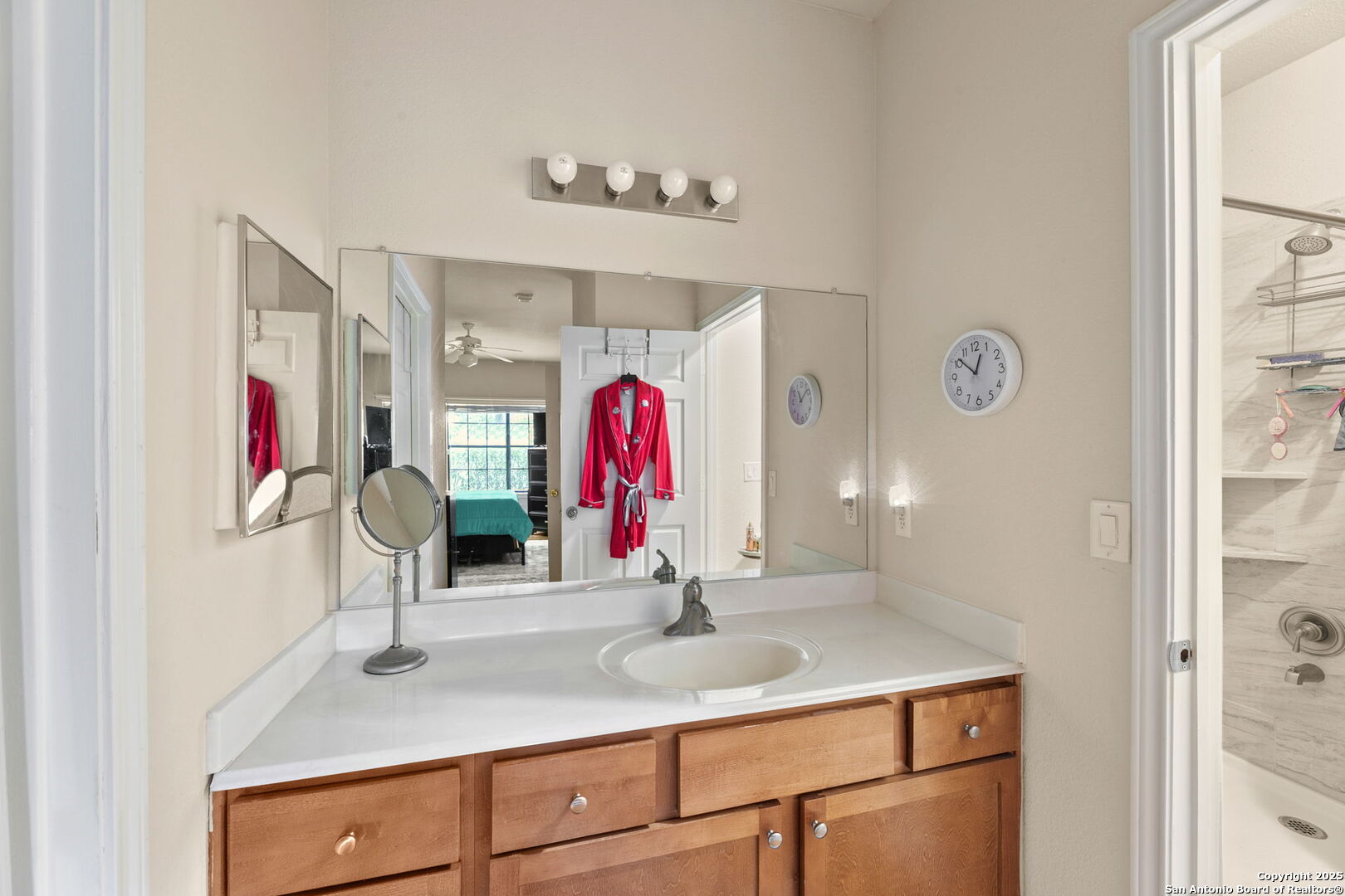 6160 Eckhert Road, Unit 204 San Antonio, TX 78240 - Photo 20 of 30 a bathroom with a sink and a mirror