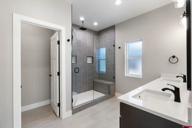 a bathroom with a sink and mirror