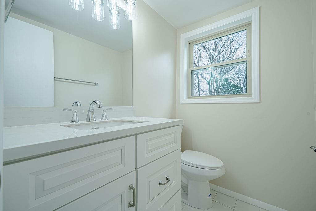 1435 Morrow Road Pittsburgh, PA 15241 - Photo 22 of 26 a bathroom with a toilet a sink and mirror