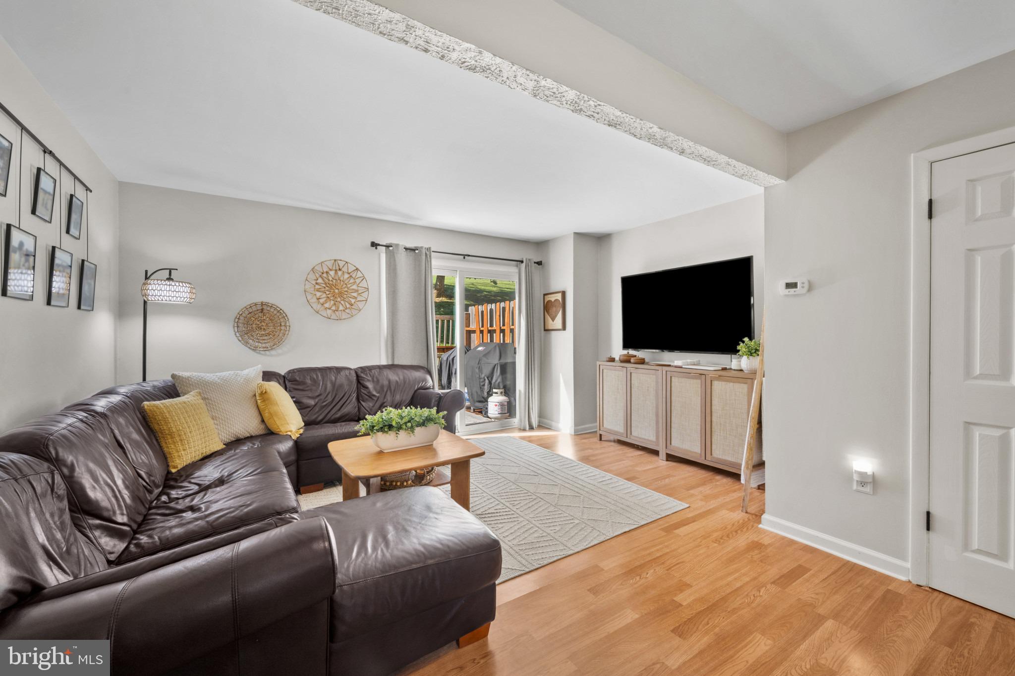 38 Ritters Ridge Court, Unit 38 Owings Mills, MD 21117 - Photo 9 of 36 Spacious living room with deck views