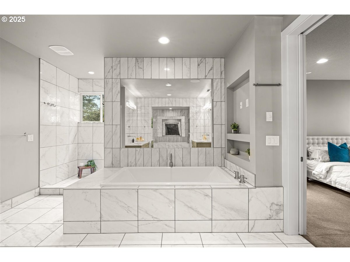 2193 Northeast 3rd Avenue Camas, WA 98607 - Photo 20 of 35 a bathroom with a tub a double vanity sink and mirrors