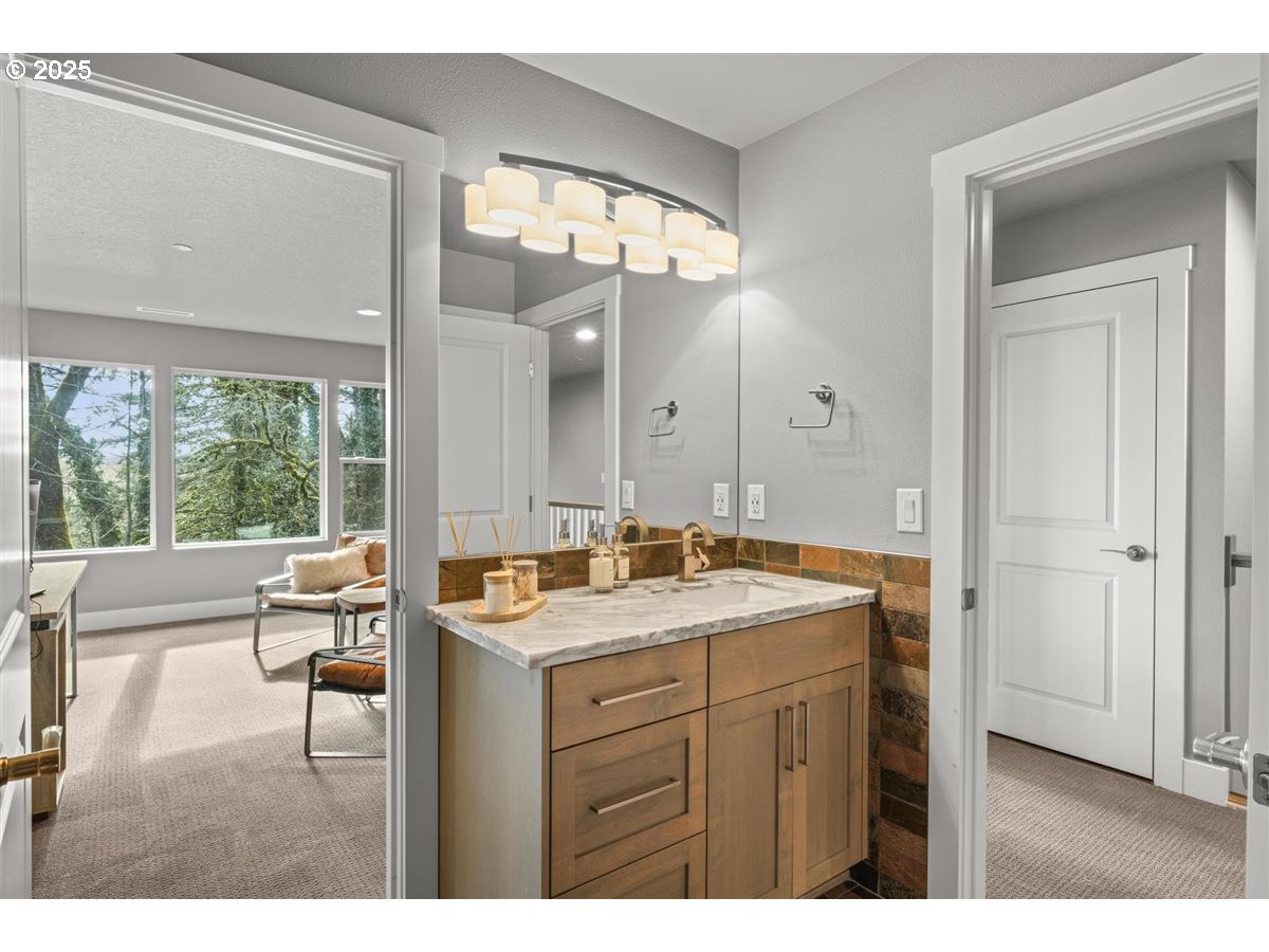 2193 Northeast 3rd Avenue Camas, WA 98607 - Photo 27 of 35 a bathroom with a sink vanity granite tub and a mirror