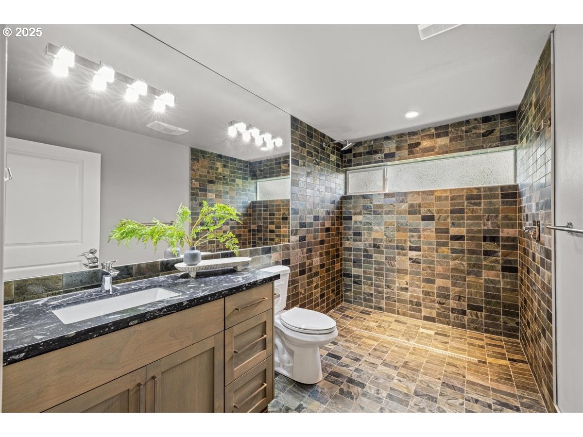 2193 Northeast 3rd Avenue Camas, WA 98607 - Photo 31 of 35 a bathroom with a sink a toilet and shower