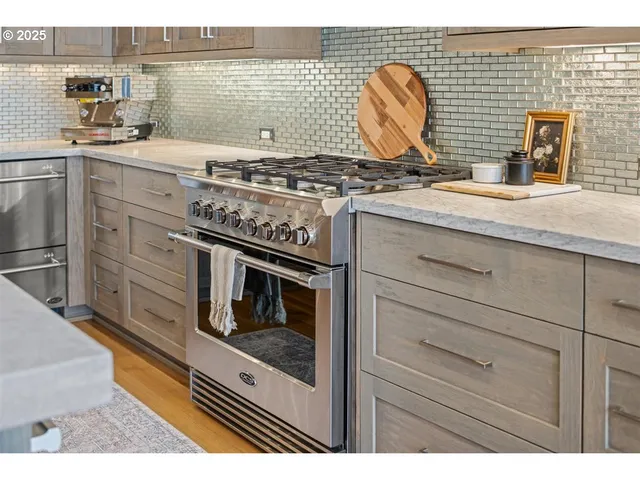 a kitchen with a stove and a sink