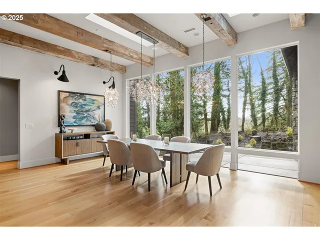 a dining room with furniture and wooden floor
