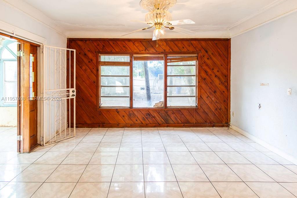 2345 Southwest 19th Street Miami, FL 33145 - Photo 4 of 21 wooden floor in an empty room with a window