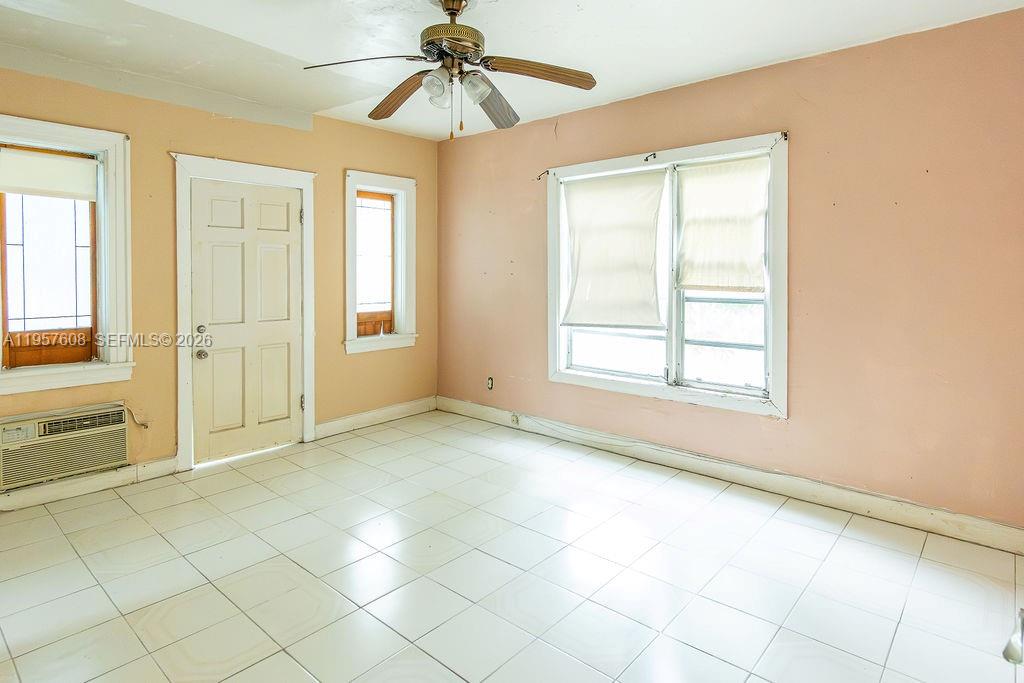 2345 Southwest 19th Street Miami, FL 33145 - Photo 7 of 21 an empty room with windows and fan