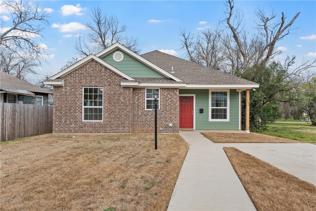 1325 North 11th Street Waco, TX 76707 - Photo 1 of 24 a front view of a house with a garden