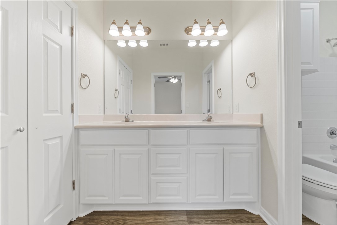 1325 North 11th Street Waco, TX 76707 - Photo 15 of 24 a bathroom with a sink vanity and a mirror