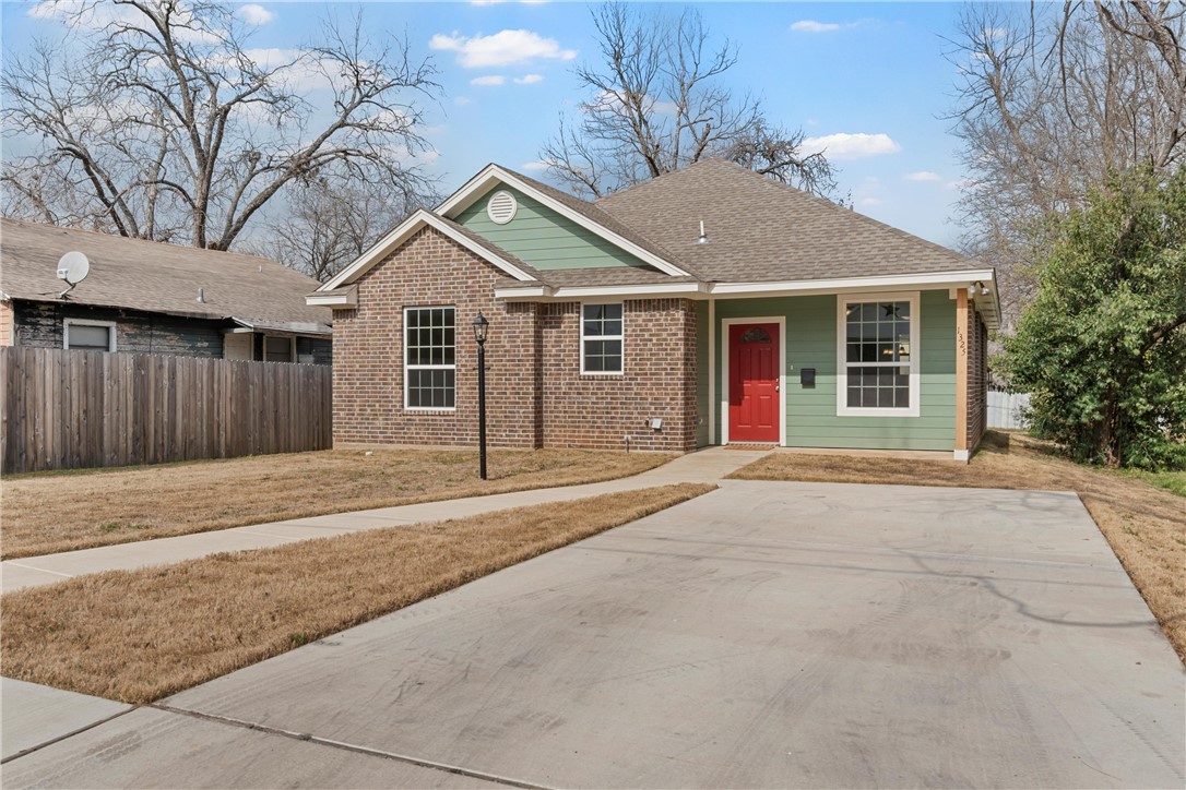 1325 North 11th Street Waco, TX 76707 - Photo 2 of 24 a front view of a house with a yard and garage