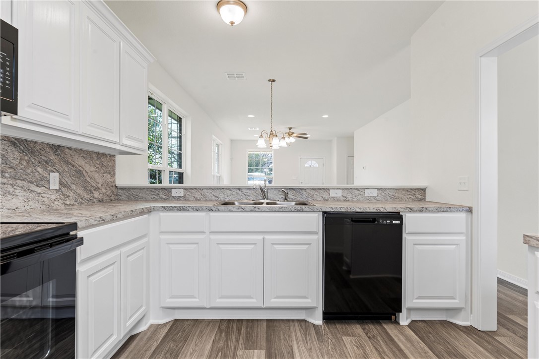 1325 North 11th Street Waco, TX 76707 - Photo 9 of 24 a kitchen with a sink and cabinets