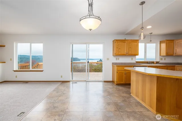 a view of a kitchen with a sink and a living room