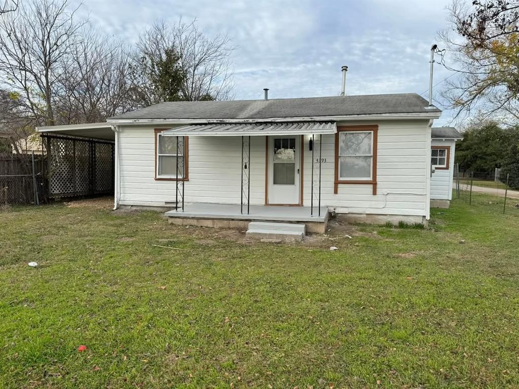 View of front of house with a carport, covered porch, and roof with shingles