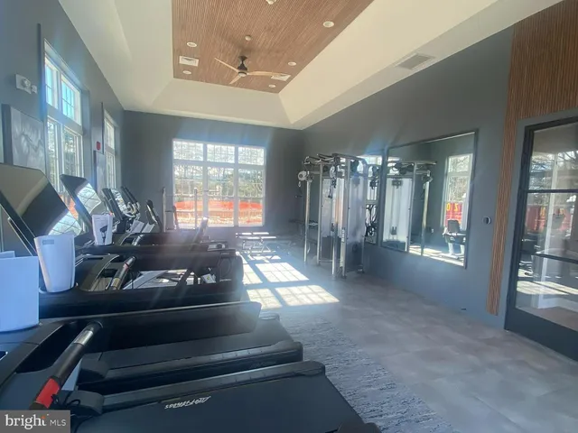 a lobby with furniture and floor to ceiling window